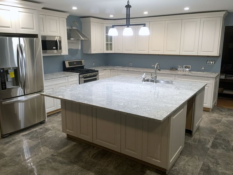 Cream kitchen with granite island and blue walls