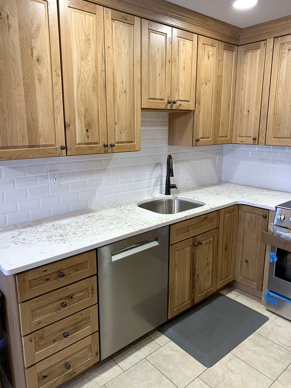 Rustic hickory kitchen with white quartz countertops