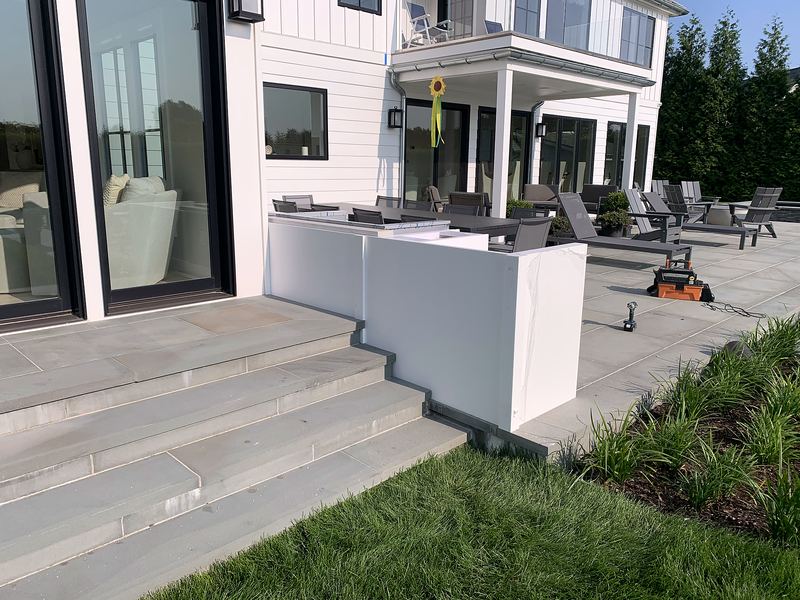 Patio outdoor kitchen with white weatherproof cabinets