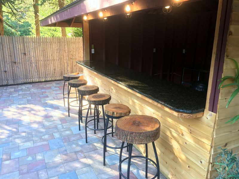 Covered outdoor bar with stools